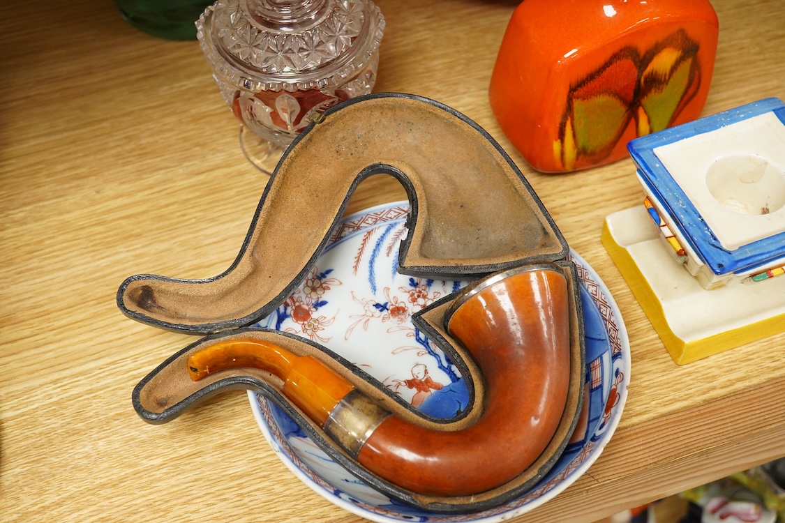 A group of mixed collectables including a Clarice Cliff Fantasque dwarf candlestick, silver mounted meerschaum pipe, etc.